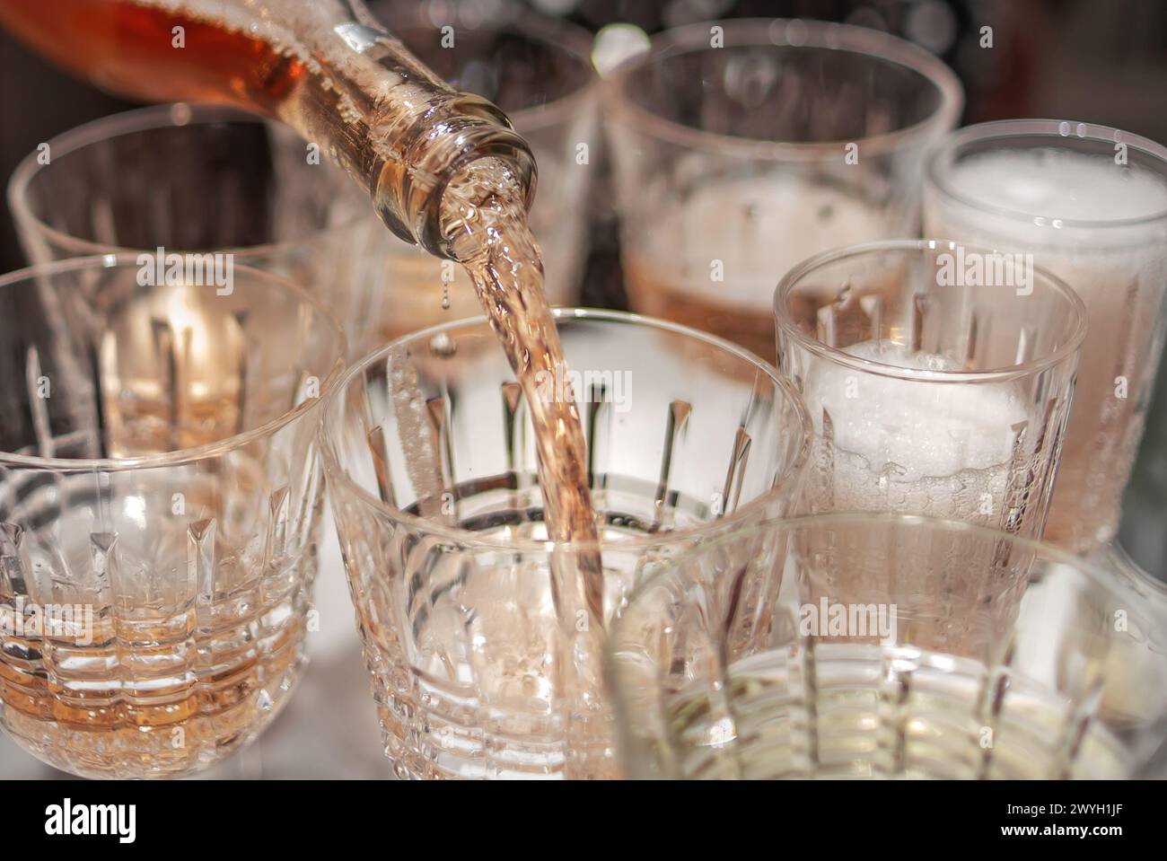 fill a glass with champagne Stock Photo