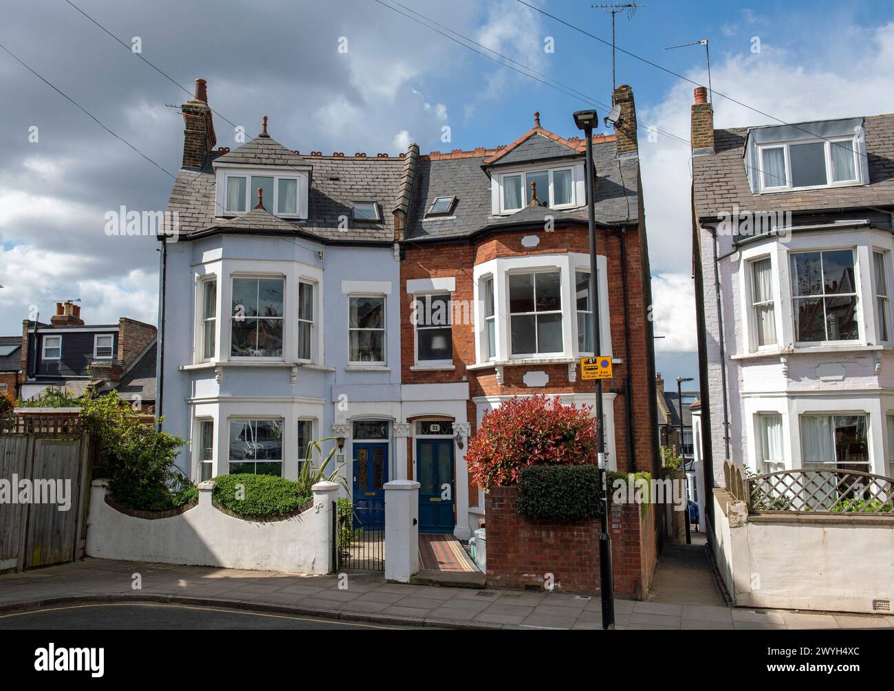 Two semi detached Victorian houses next to alleyway, Highbury, London Borough of Islington England Britain UK Stock Photo