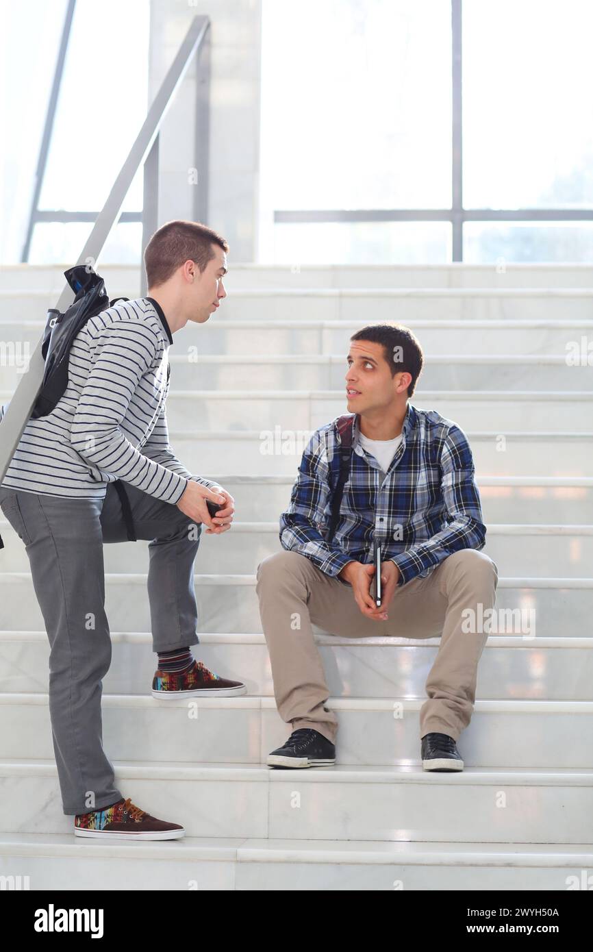 Two students talking men only hi-res stock photography and images - Alamy