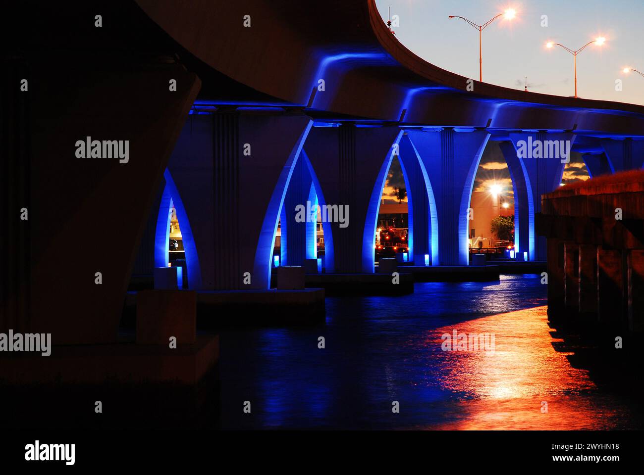 The Port Boulevard Bridge in Miami Florida is illuminated with blue ...