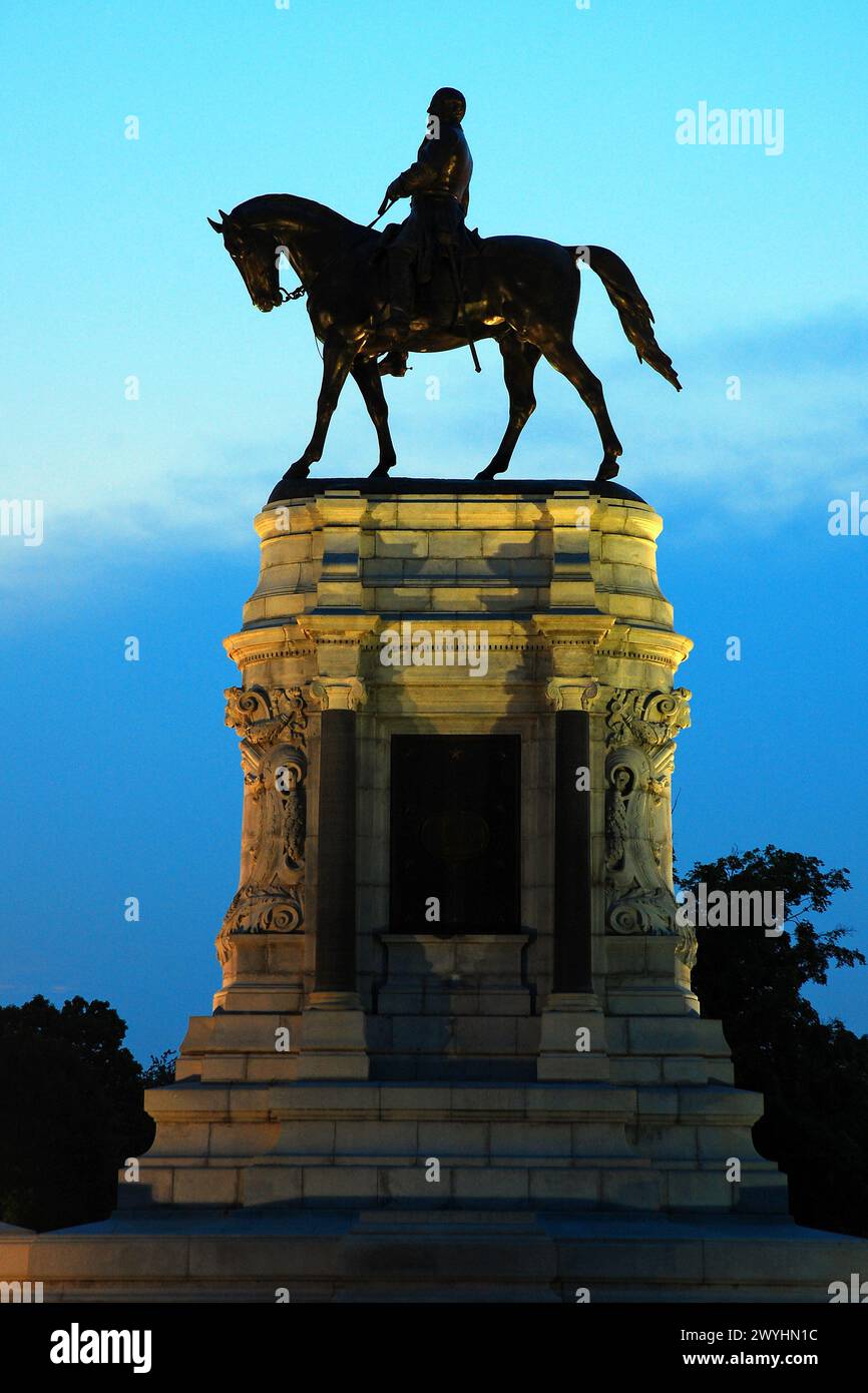 A Statue of Confederate General Robert E Lee that once stood in Richmond Virginia is illuminated at dusk. Stock Photo