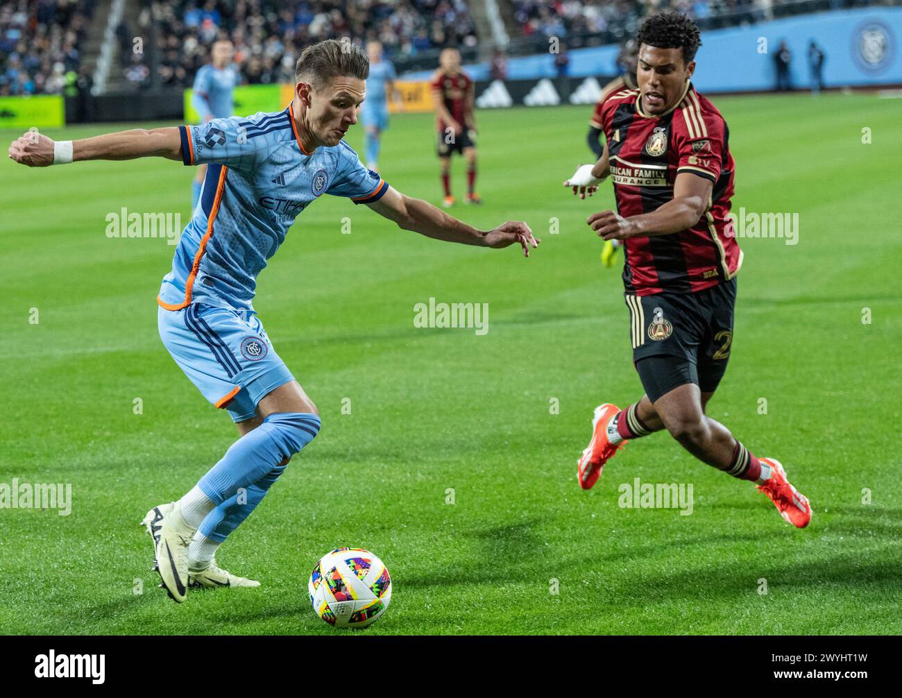 Hannes Wolf (17) of NYCFC and Caleb Wiley (26) of Atlanta United FC fight for ball during regular MLS match at Citi Field in New York on April 6, 2024. Game ended in draw 1 - 1 Stock Photo