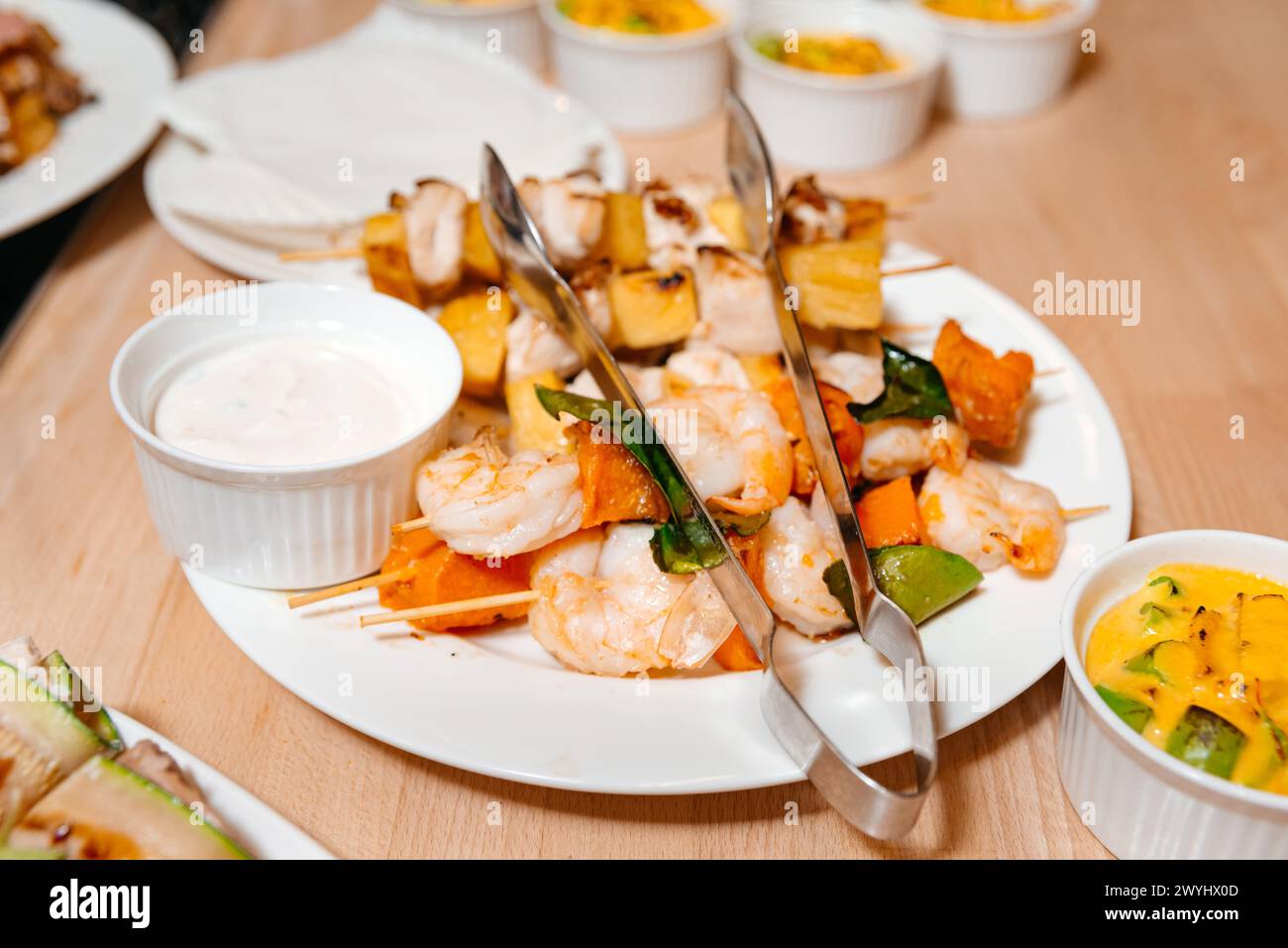 Succulent grilled shrimp skewers paired with tropical fruits and a ...