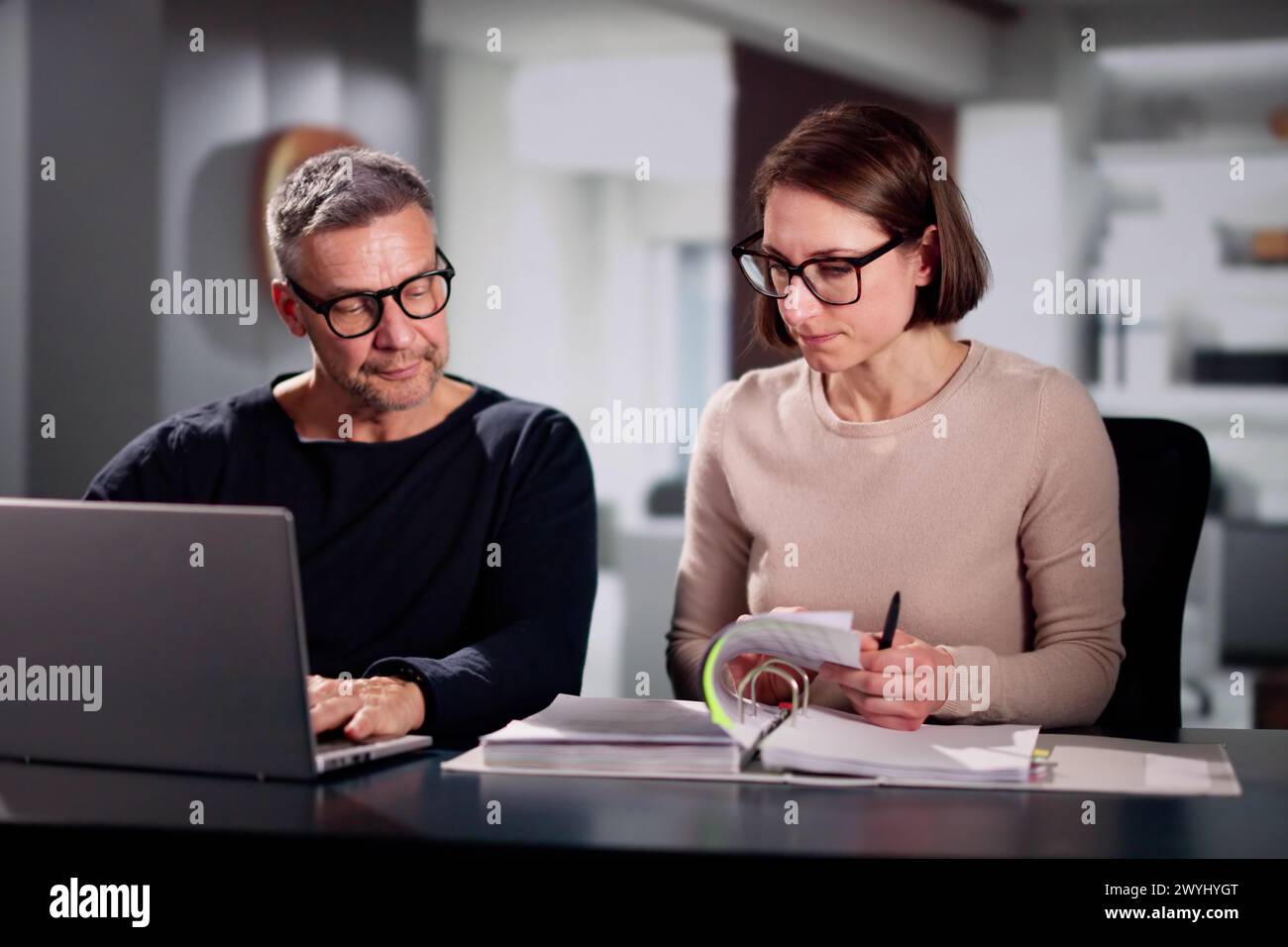 Couple Doing Taxes And Family Budget On Computer Stock Photo