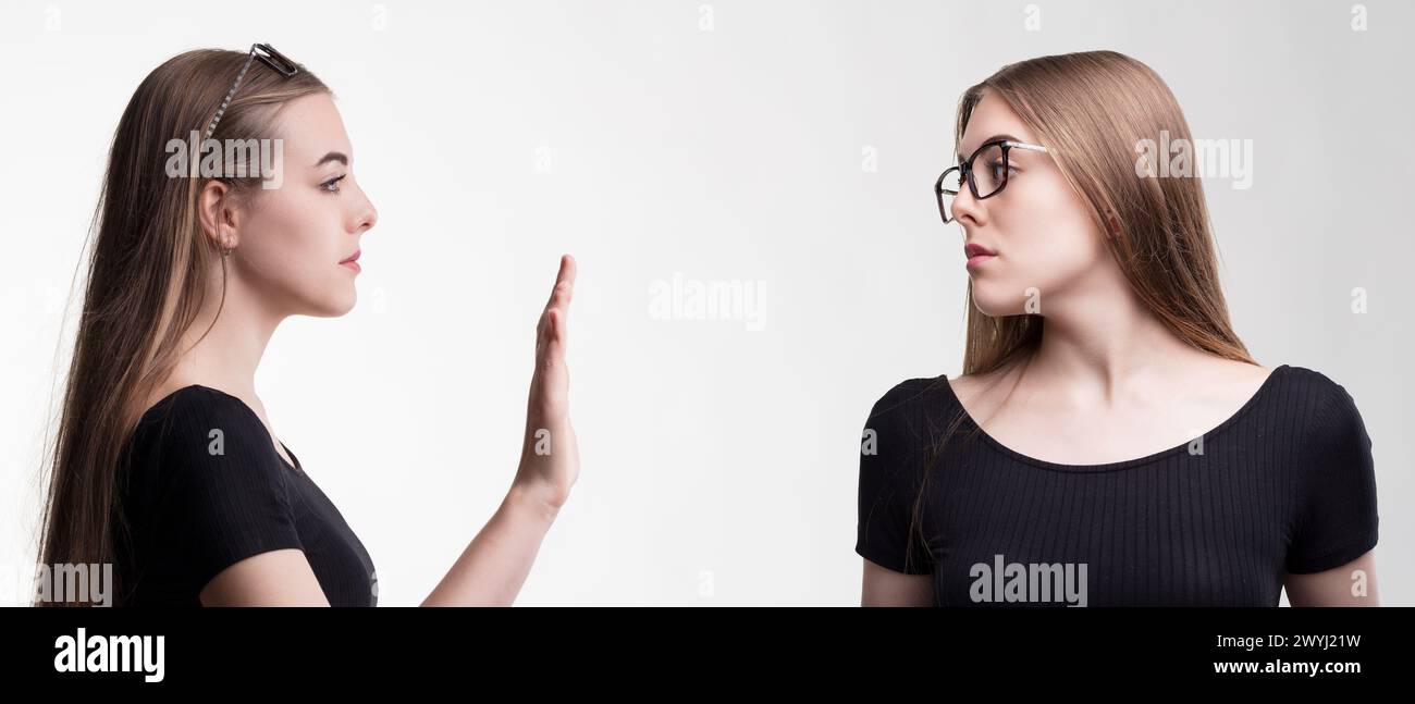 The offer of camaraderie is dismissed by a look of superiority and disinterest Stock Photo