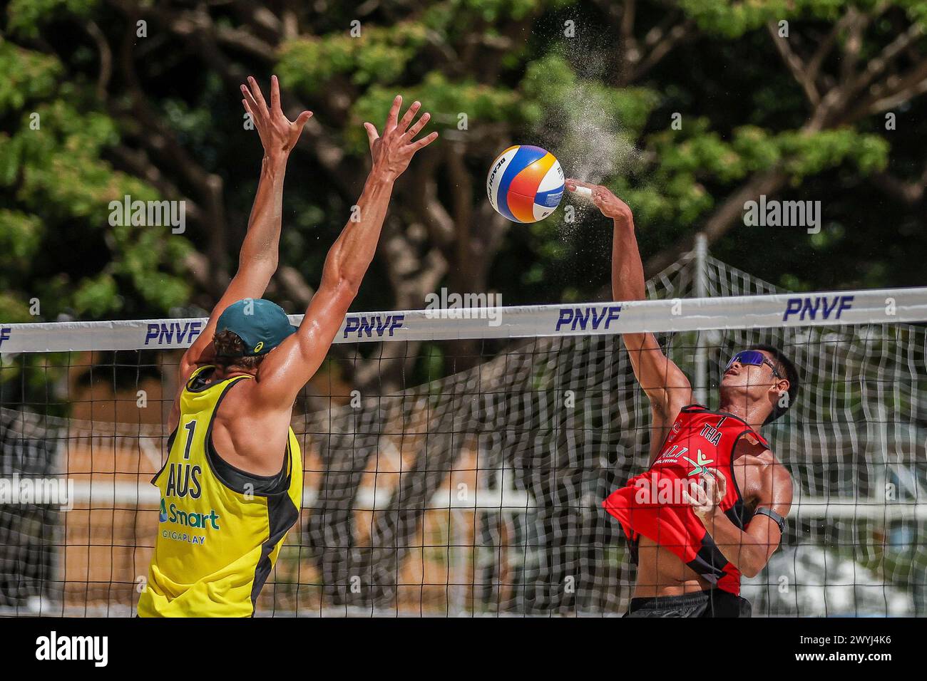 Laguna Province, Philippines. 7th Apr, 2024. Thailand's Pithak Tipjan (R) spikes during the men's semifinals match between D'Artagnan Potts/Ben Hood of Australia and Pithak Tipjan/Taovato Poravid of Thailand at the Asian Volleyball Confederation (AVC) Beach Volleyball Tour Nuvali Open in Laguna Province, the Philippines, on April 7, 2024. Credit: Rouelle Umali/Xinhua/Alamy Live News Stock Photo