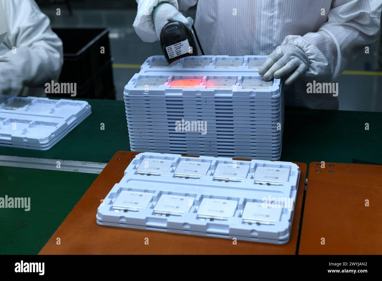 HAIAN, CHINA APRIL 7, 2024 A skilled worker is producing consumer