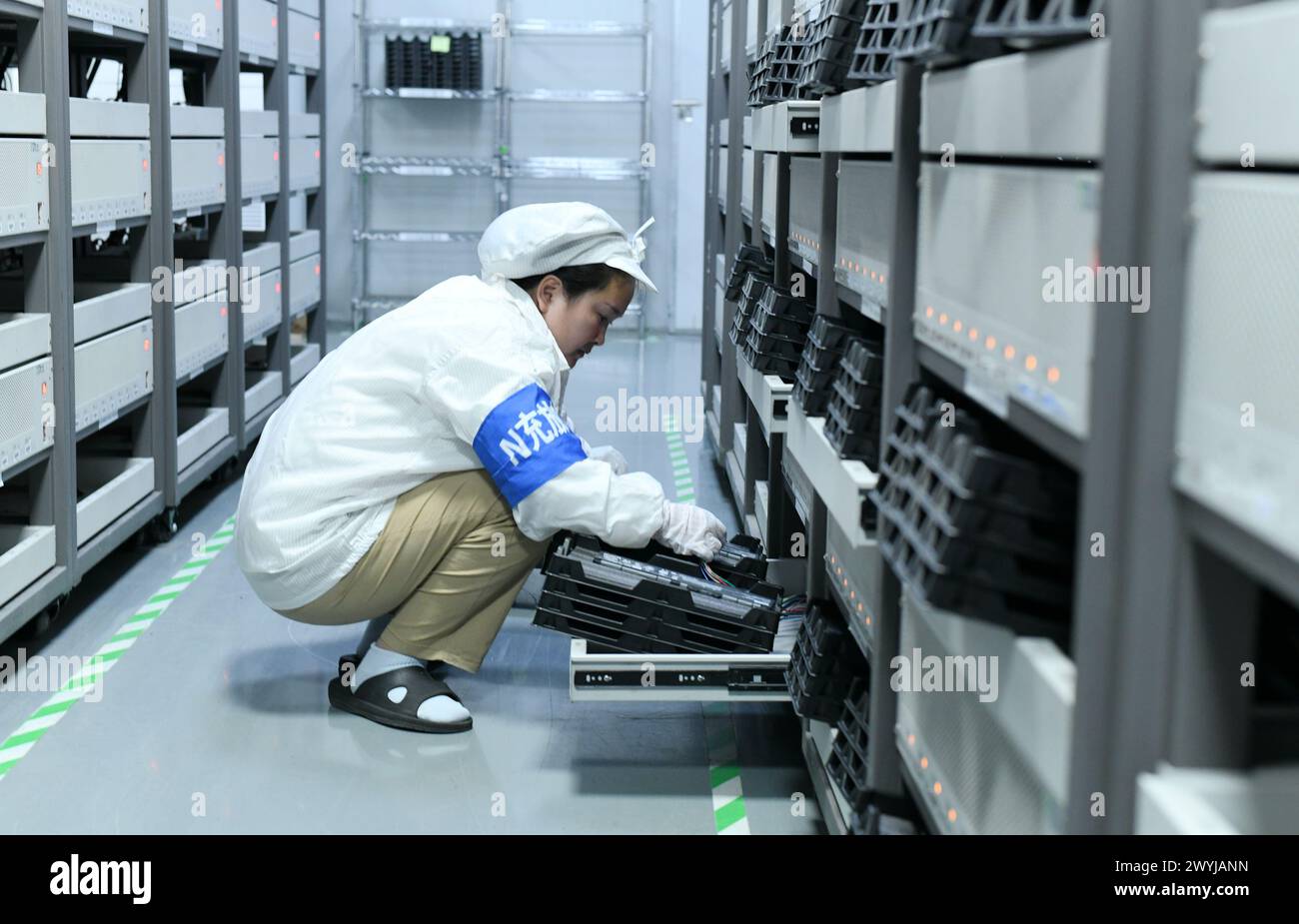 HAIAN, CHINA APRIL 7, 2024 A skilled worker is producing consumer