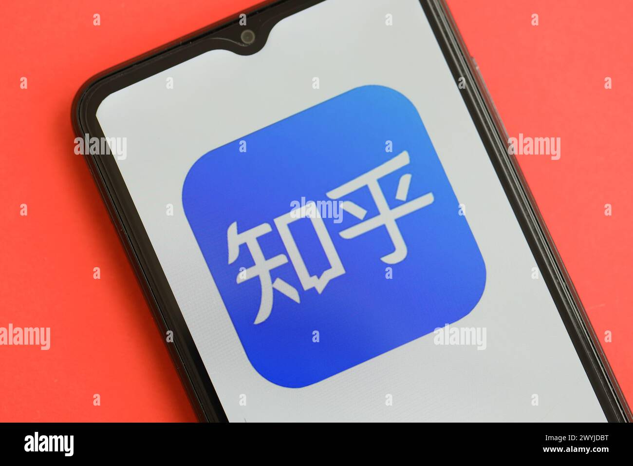 KYIV, UKRAINE APRIL 1, 2024 Zhihu icon on smartphone screen on red