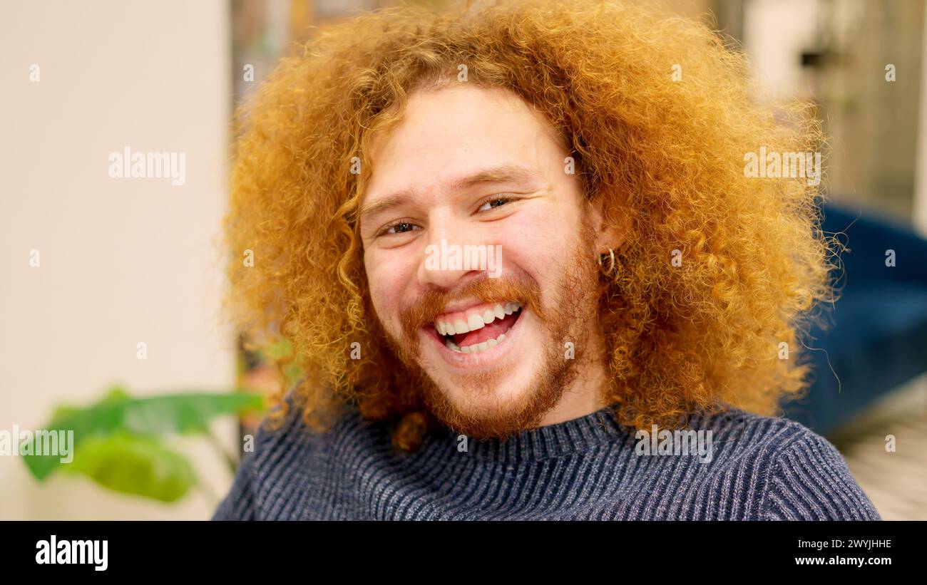 Cheerful man curly hair hi-res stock photography and images - Alamy