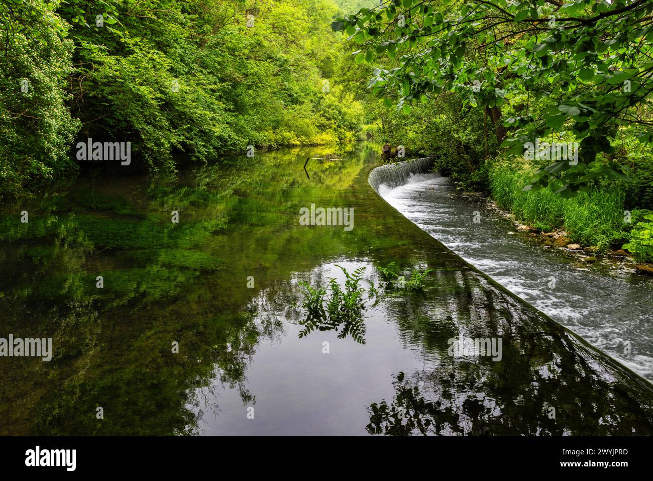 Weir on the river Wye in Monsal Dale in the Peak District in Derbyshire, England Stock Photo