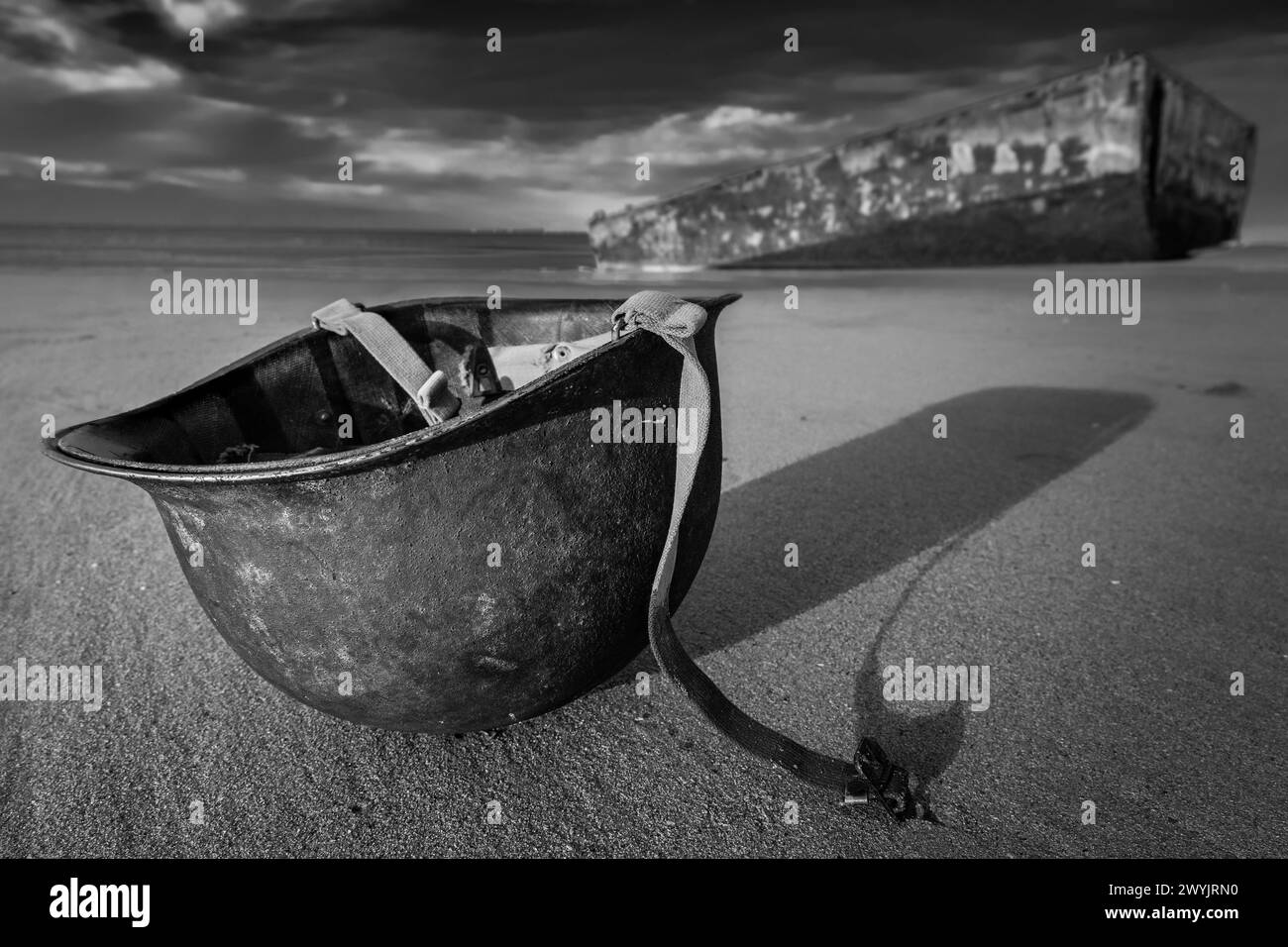 France, Calvados, Arromanches les Bains, American heavy helmet on the beach, Mulberry B remains, Port Winston, Phoenix breakwaters, Gold Beach, Allied invasion of German-occupied France in the Normandy landings on 6 June 1944 Stock Photo