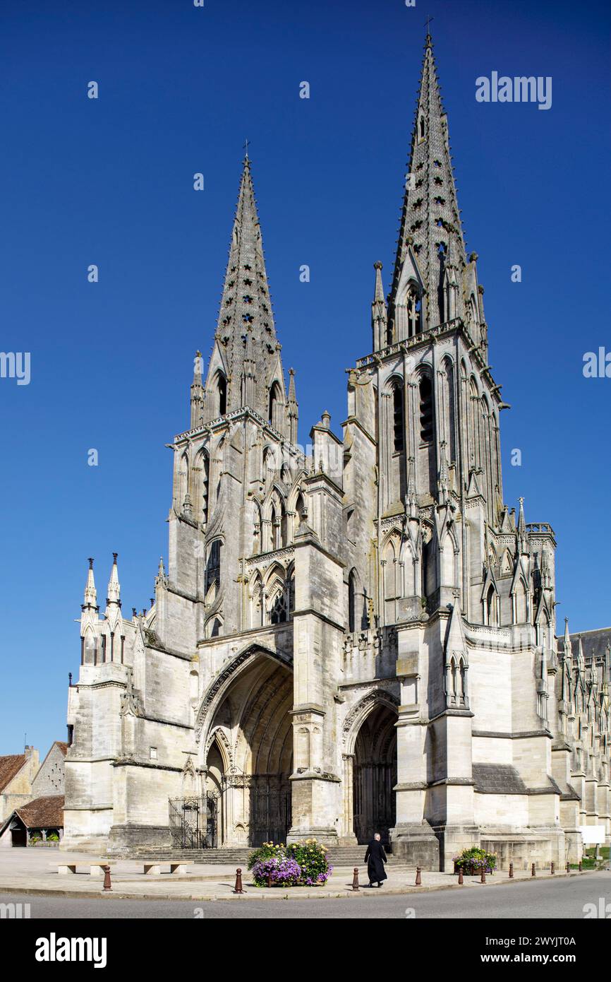 France, Orne, Sées, priest walking in front of the cathedral Stock Photo