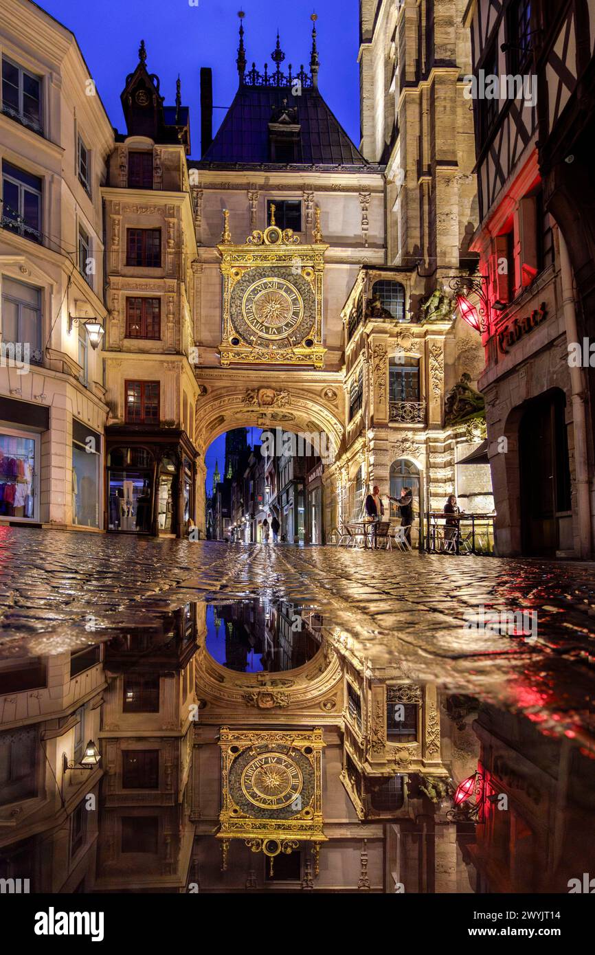 France, Seine-Maritime, Rouen, reflection of the Gros-Horloge in a puddle of rainwater on the cobblestones of the street, astronomical clock with 14th century mechanism and 16th century dial Stock Photo