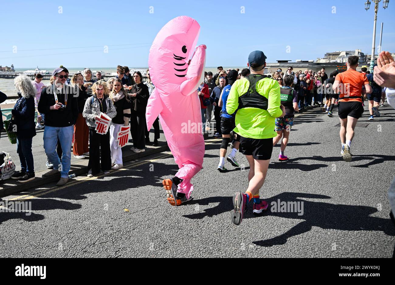 Brighton UK 7th April 2024 - Thousands of runners, some in fancy dress take part in the Brighton Marathon on a bright sunny but windy day  : Credit Simon Dack / Alamy Live News Stock Photo