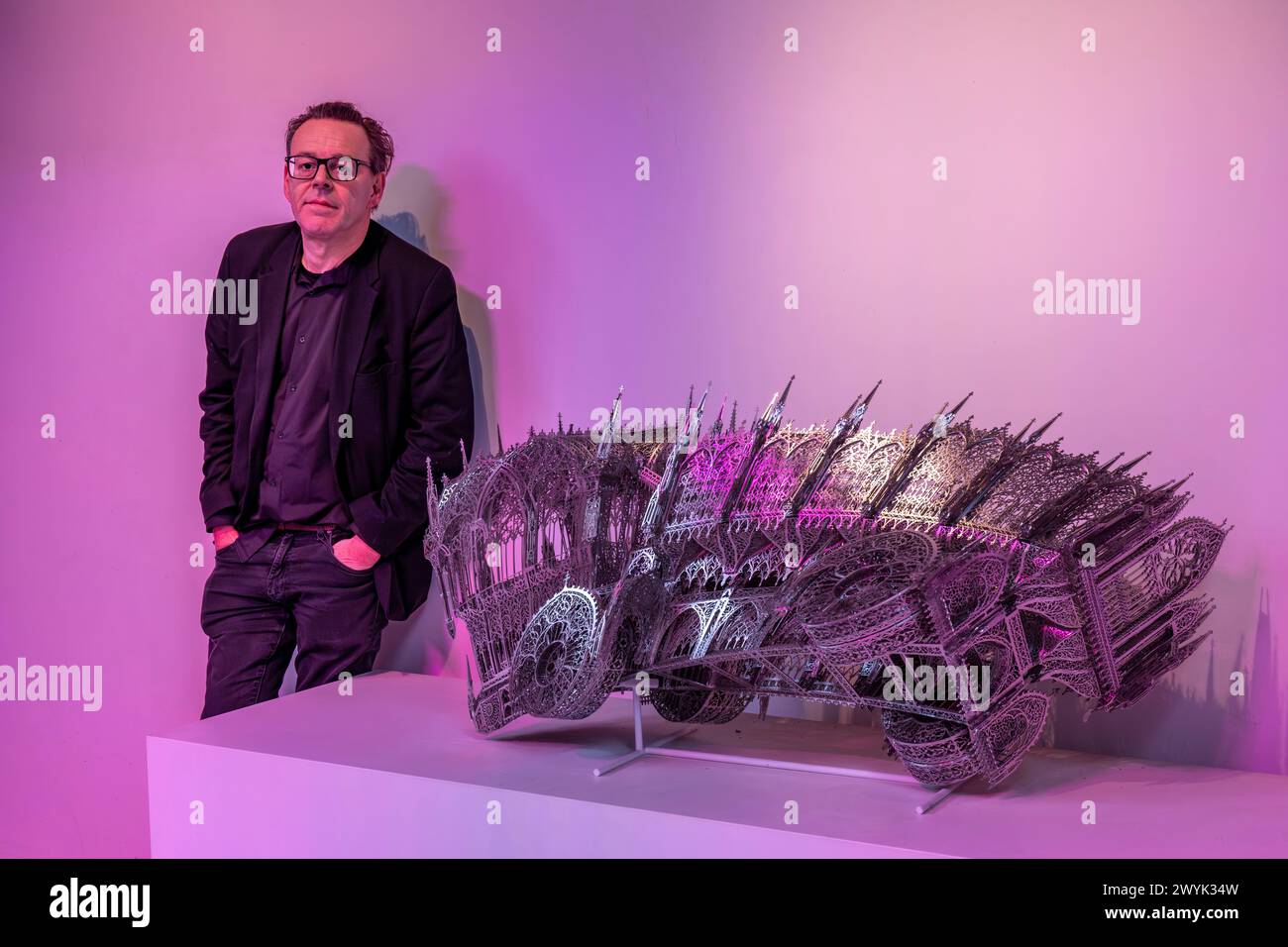 Belgium, East Flanders, Ghent, Studio Wim Delvoye, the artist Wim Delvoye with Twisted Dump Truck, laser-cut stainless steel Stock Photo