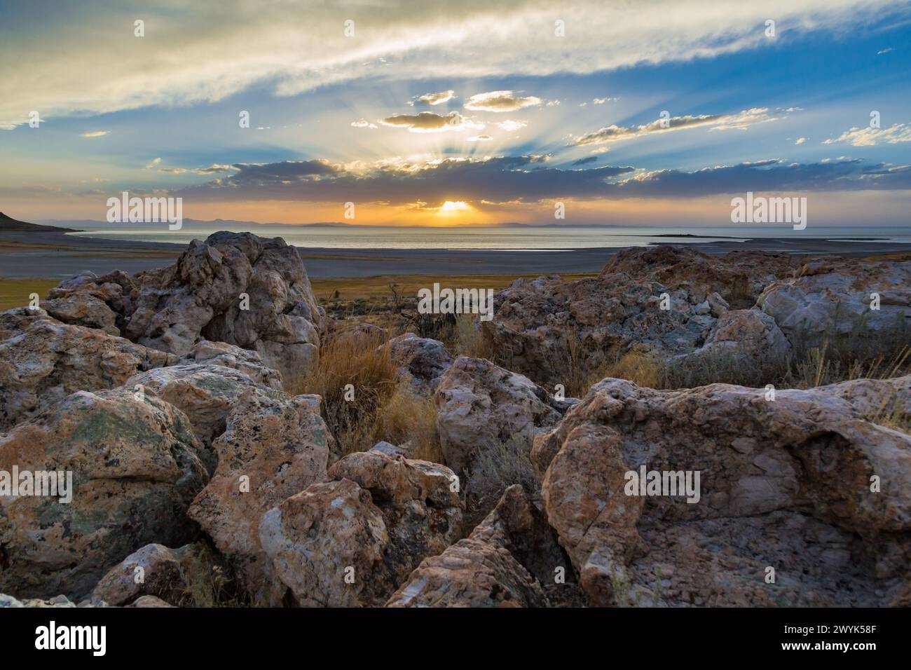 Setting sun over the Great Salt Lake in the Antelope Island State Park near Syracuse, Utah Stock Photo