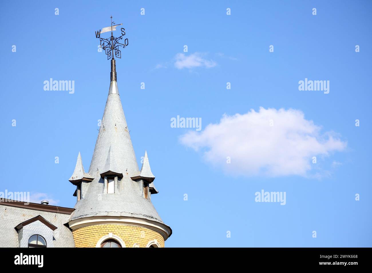 a building with several towers on a blue sky background Stock Photo