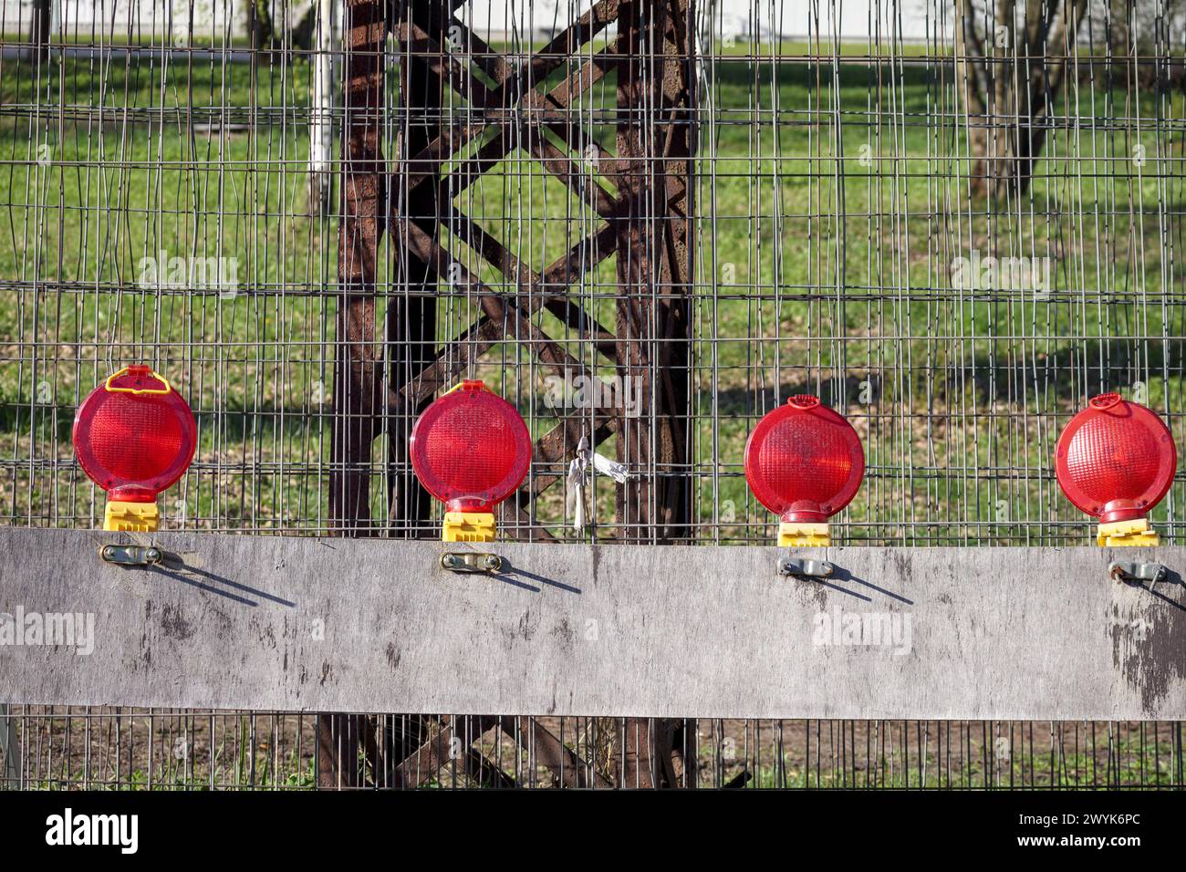 red and yellow lanterns on the street during repair work Stock Photo
