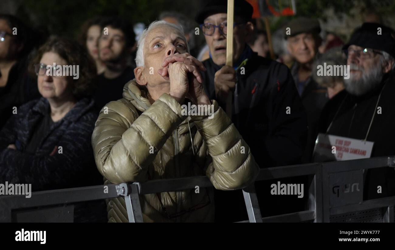 An Israeli woman looks dejected during a demonstration marking hostages’ six months in captivity near PM Benjamin Netanyahu's official residence calling for the release of Israeli hostages held in the Gaza Strip, and against Israeli prime Minister Benjamin Netanyahu and his government on April 6, 2024 in Jerusalem. Israel Stock Photo