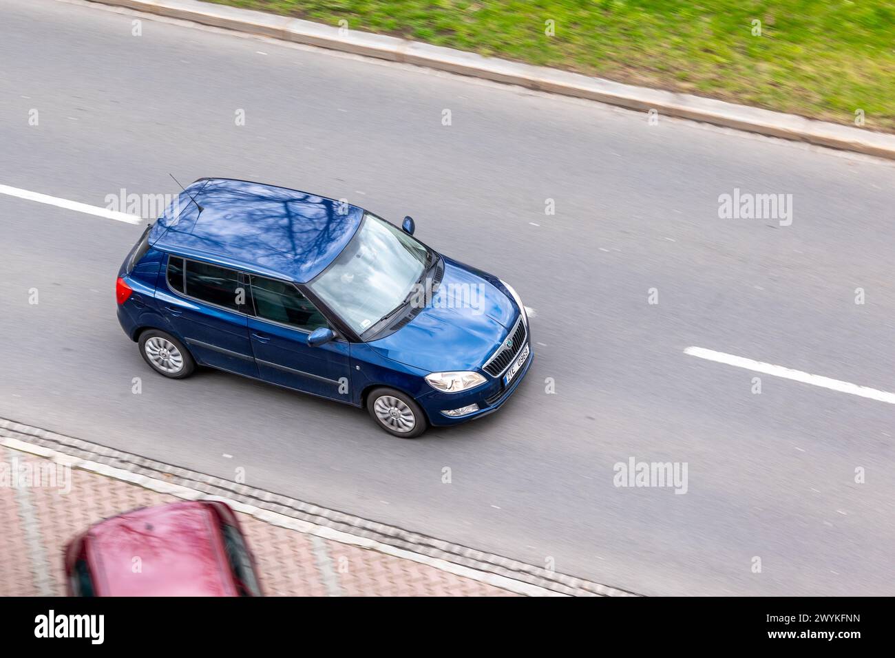 OSTRAVA, CZECH REPUBLIC - MARCH 24, 2024: Blue Skoda Fabia II vehicle after facelift with motion blur effect in top view Stock Photo