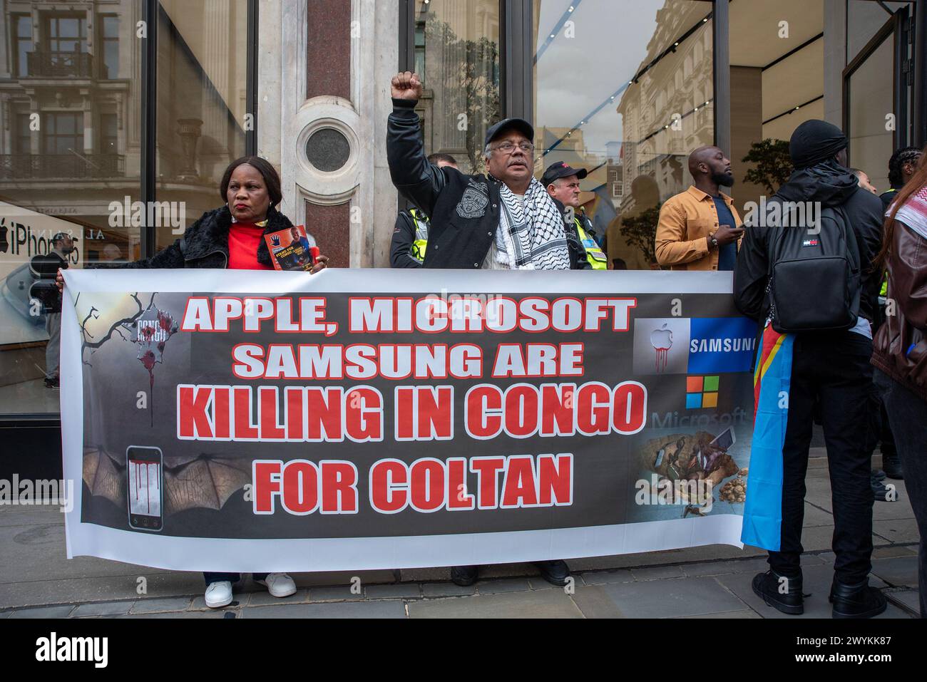 London, UK. 6th Apr, 2024. Protesters hold a banner front of the Apple HQ in London. Congolese diaspora and their allies protested front of the London HQ of Apple against the violence and the mineral exploitation in Eastern part of the Democratic Republic of Congo (DRC), where the fights is going on between the Congolese forces and the Rwanda backed M23 rebel group. The conflict created a growing refugee crisis, human right abuses and cheap labor for mining. All minerals like Coltan, Cobalt, etc. which are used by companies like Apple on phones and batteries. (Credit Image: © Krisz Stock Photo