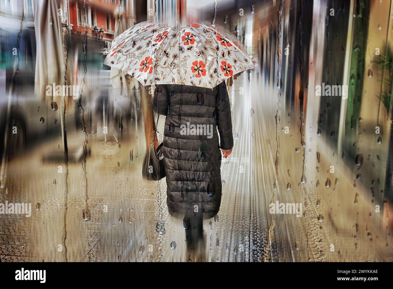 One person with an umbrella hi-res stock photography and images - Alamy