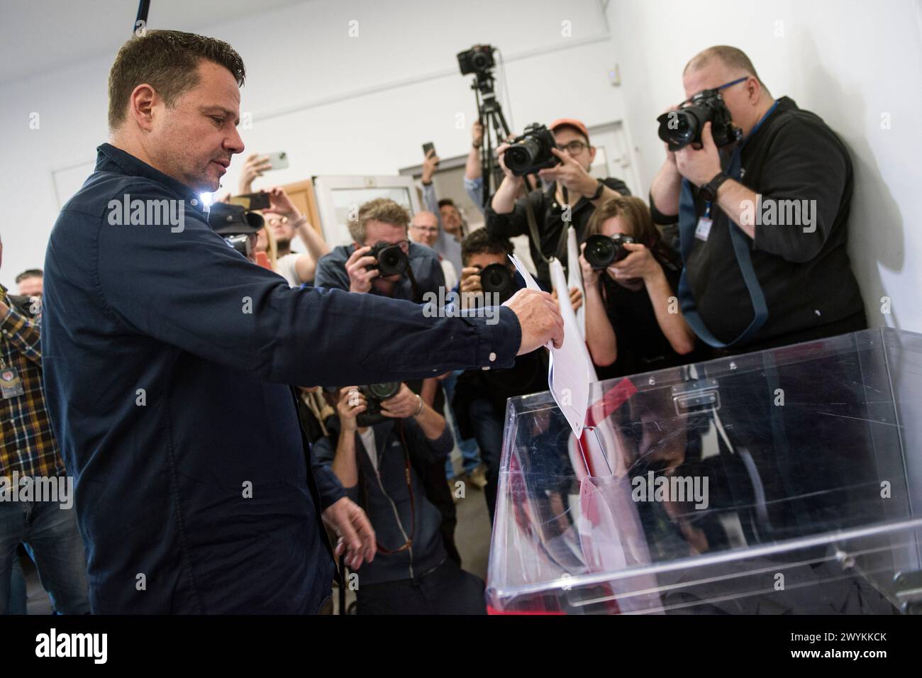 Rafal Trzaskowski, Mayor of Warsaw who is seeking a second term, casts his vote at the polling station in Warsaw. Voters across Poland are casting ballots in local elections in the first electoral test for the coalition government of PM Donald Tusk nearly four months since it took power. Voters elected mayors as well as members of municipal councils and provincial assemblies. Among those running is Rafal Trzaskowski - Mayor of Warsaw, a Tusk ally who is seeking a second term. Opinion polls showed the two largest political formations running neck-and-neck: Tusk's Civic Coalition, an electoral Stock Photo