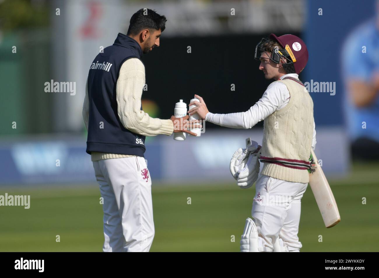 Canterbury, England. 7th Apr 2024. Shoaib Bashir of Somerset and England provides drinks as 12th man during day three of the Vitality County Championship Division One fixture between Kent County Cricket Club and Somerset County Cricket Club at the Spitfire Ground, St Lawrence. Kyle Andrews/Alamy Live News. Stock Photo