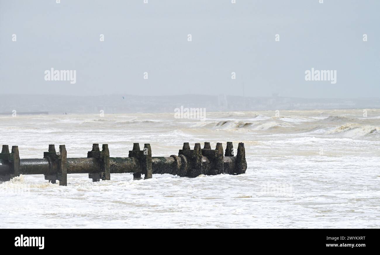 The Southern Water sea outfall pipe at Lancing beach on the Sussex coast between Worthing and Brighton , UK Stock Photo