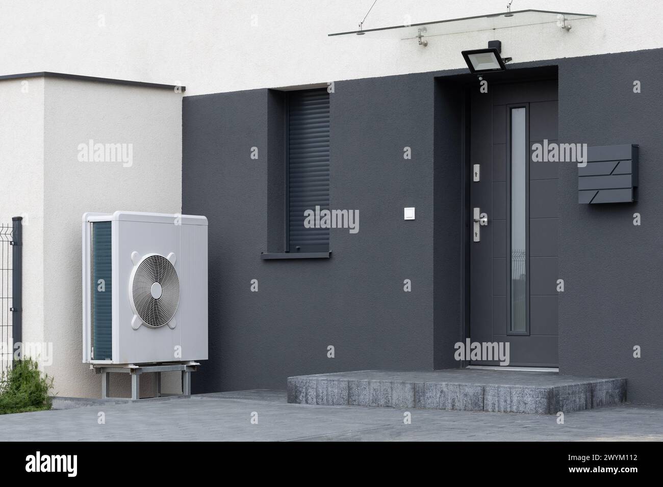 View of Modern Home with Heat Pump Stock Photo - Alamy