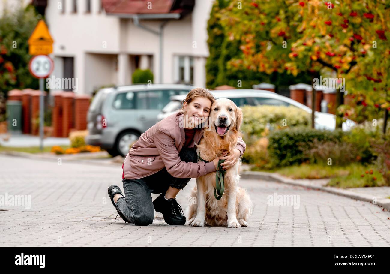 Teen girl walking dog hi-res stock photography and images - Alamy
