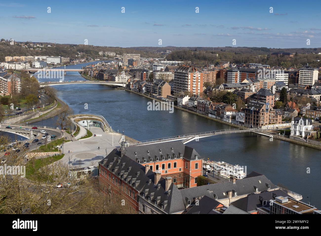Panoramic view from the Citadel of Namur, Belgium, accross the river Meuse and its new footbridge to Jambes. Sunny spring day with blue sky. Copy spac Stock Photo