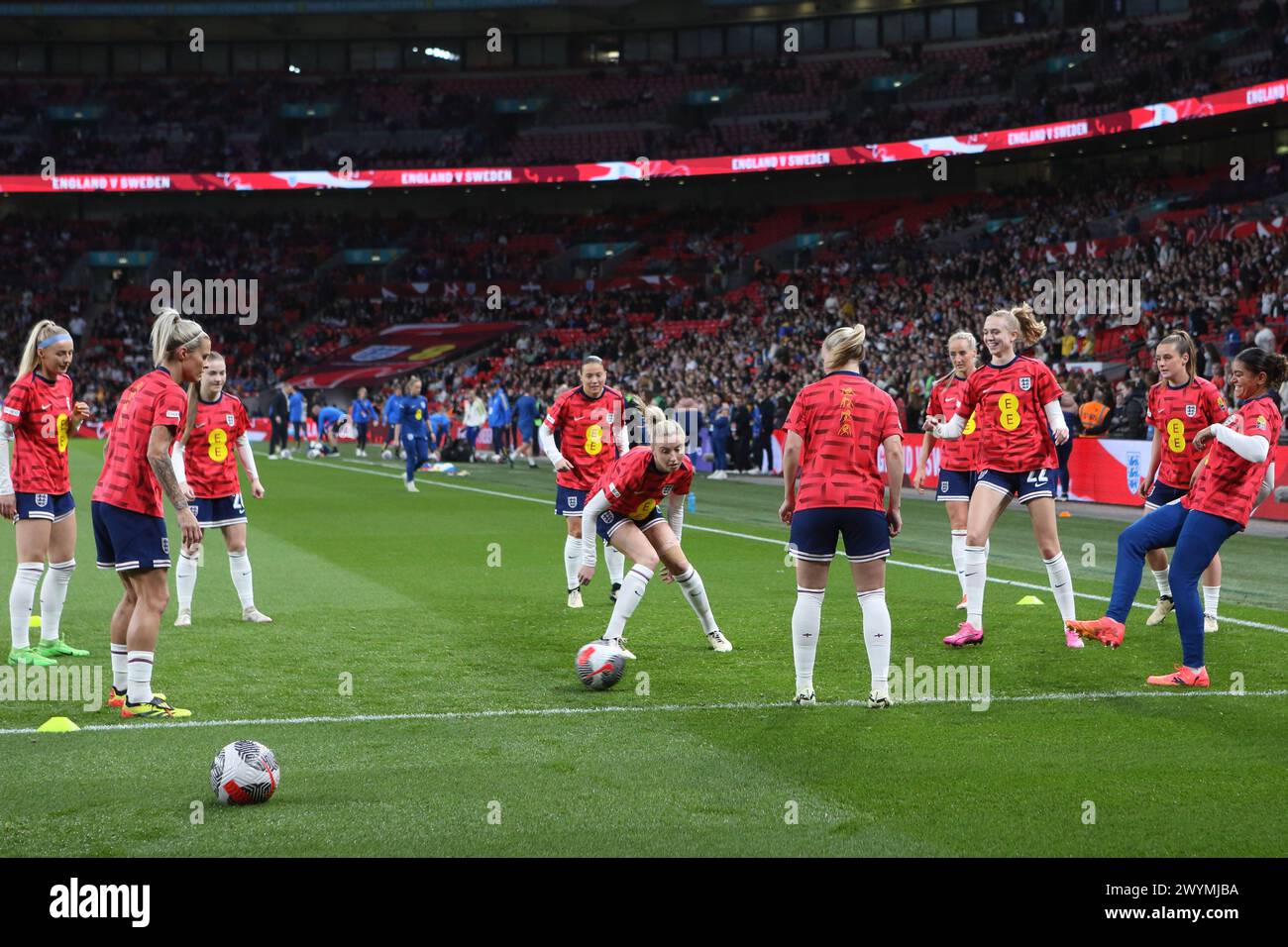 England players warm up in special BSL British Sign Language shirts England v Sweden UEFA Women's Euro qualifier Wembley Stadium, London, 5 April 2024 Stock Photo