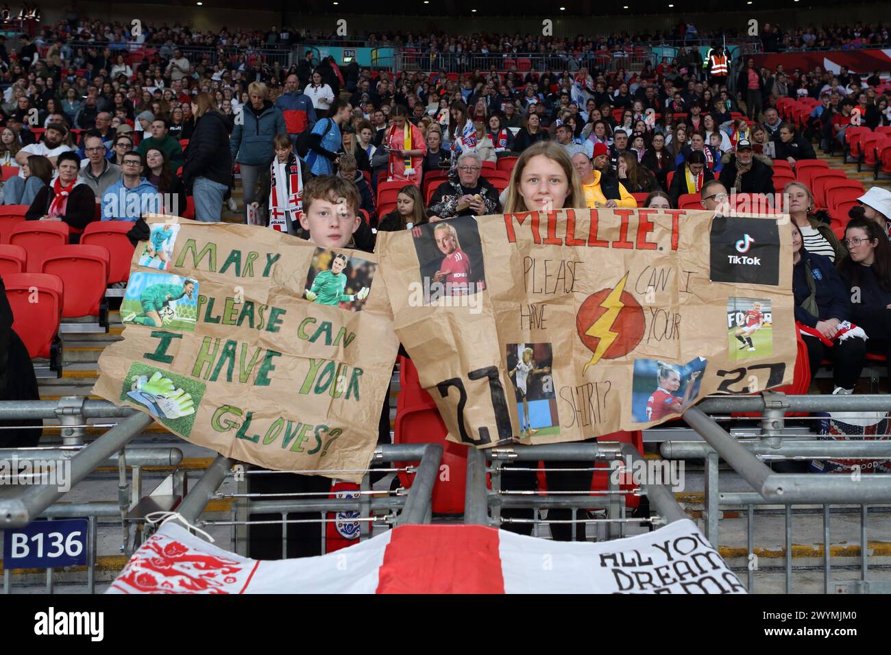 Fans with brown paper placards posters Mary Earps Milie Turner England v Sweden UEFA Women's Euro qualifier Wembley Stadium, London, 5 April 2024 Stock Photo