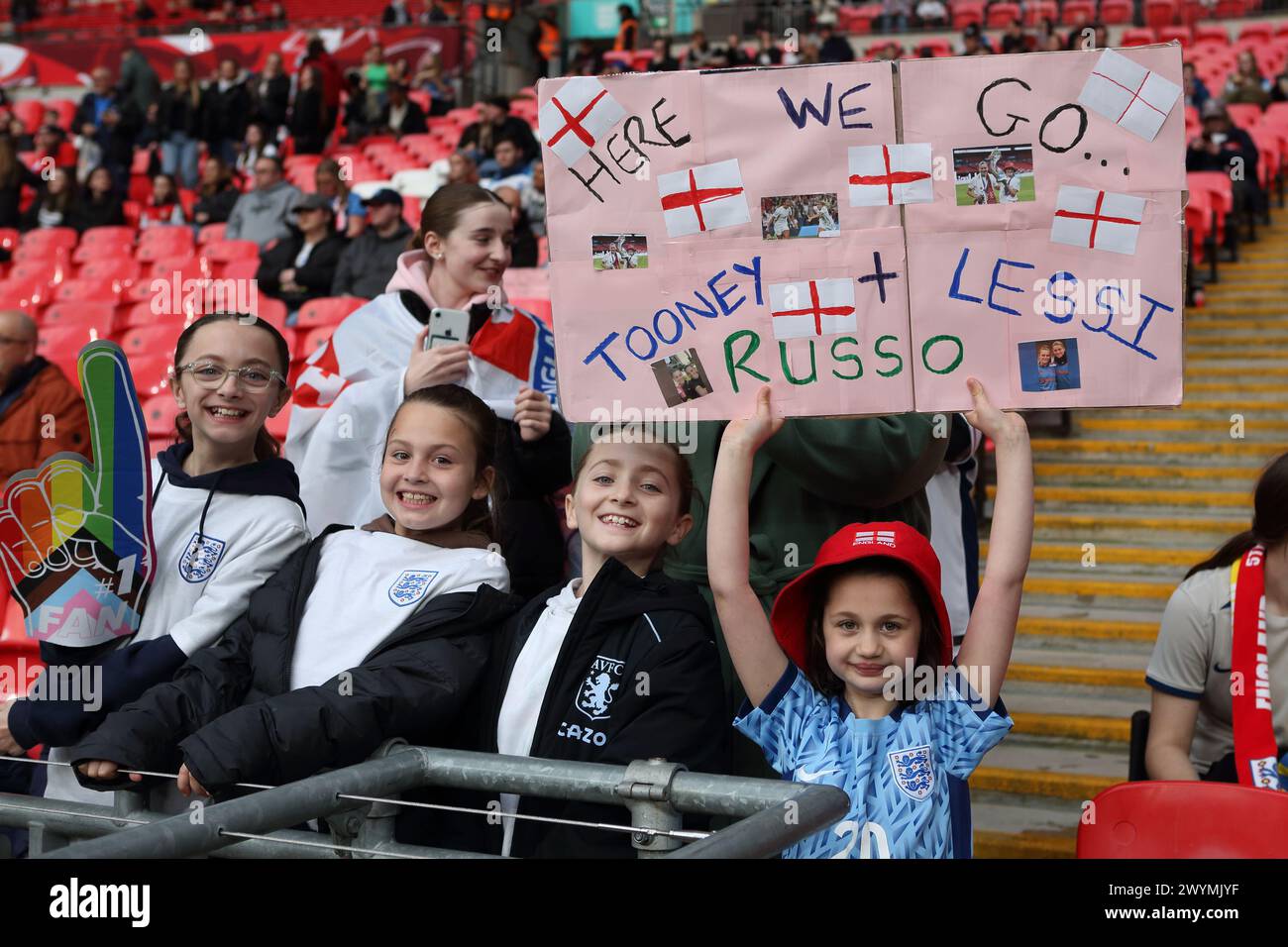 Young girl fan holds Tooney and Lessi Russo placard England v Sweden UEFA Women's Euro football qualifier Wembley Stadium, London, 5 April 2024 Stock Photo