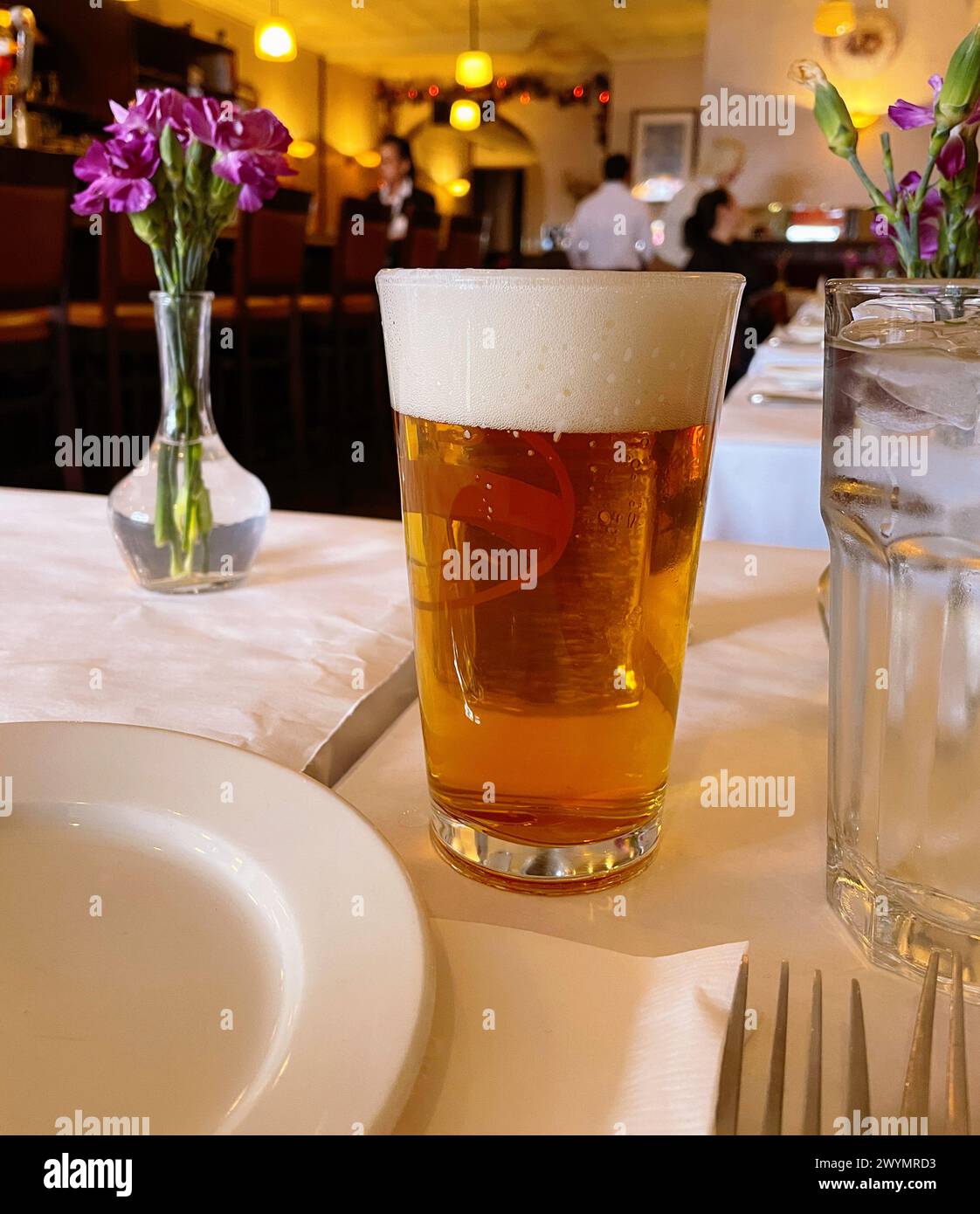 Interior of  Bistro Les Amis Restaurant in SoHo, NYC, USA, 2024, Perfectly Poured Draft Beer Stock Photo