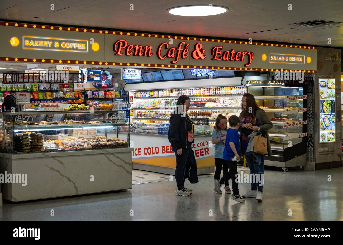 Shopping concourse in Penn Station is well lit, 2024, New York City, USA Stock Photo