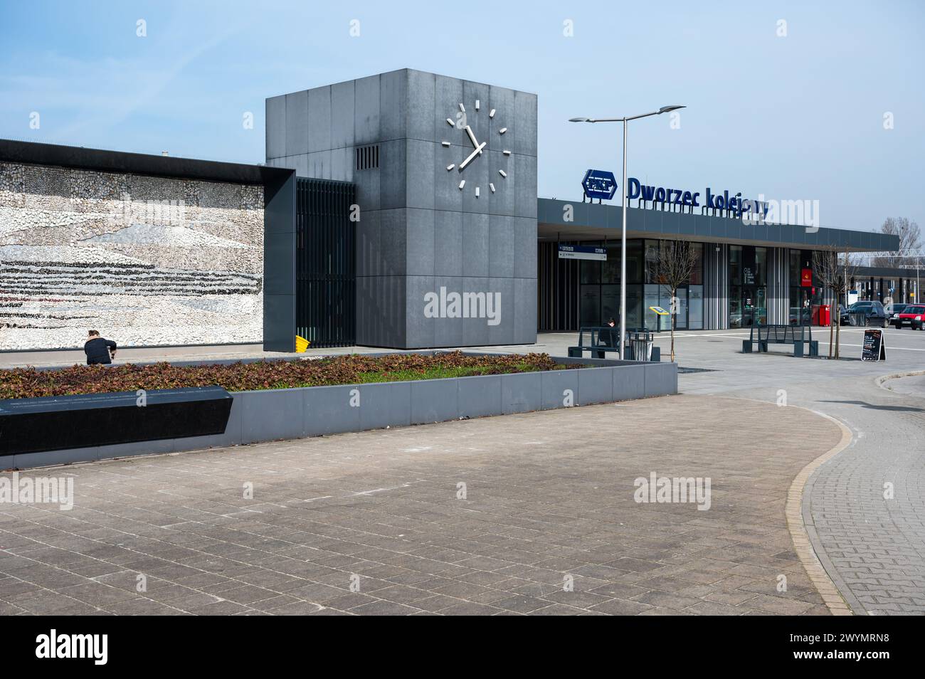 Auschwitz, Poland, March 21, 2024 - The railwaystation and square with a clock Stock Photo