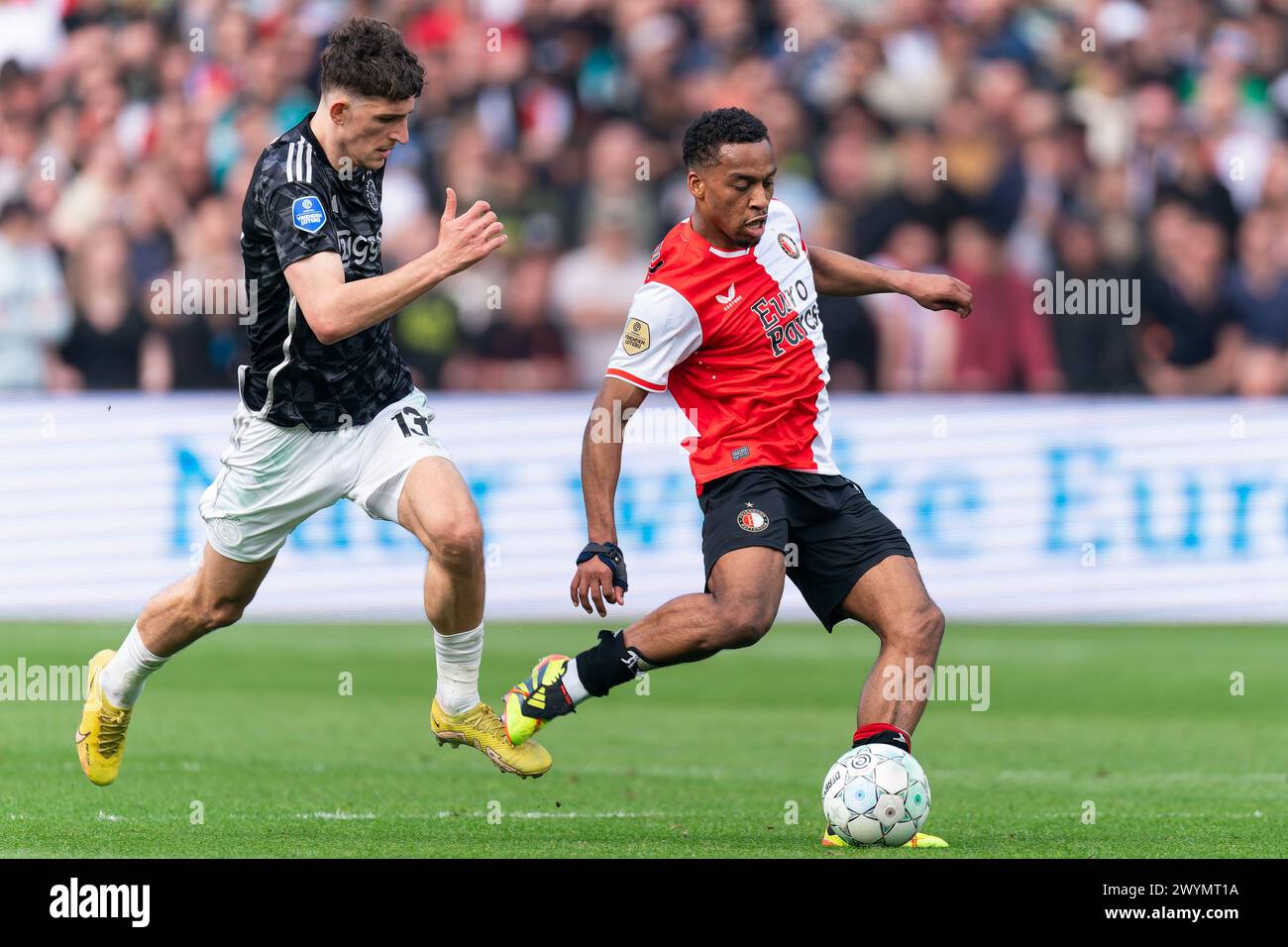 Rotterdam, Netherlands. 07th Apr, 2024. ROTTERDAM, NETHERLANDS - APRIL 7: Ahmetcan Kaplan of Ajax battles for the ball with Quinten Timber of Feyenoord during the Dutch Eredivisie match between Feyenoord and Ajax at Stadion Feijenoord on April 7, 2024 in Rotterdam, Netherlands. (Photo by Joris Verwijst/Orange Pictures) Credit: Orange Pics BV/Alamy Live News Stock Photo