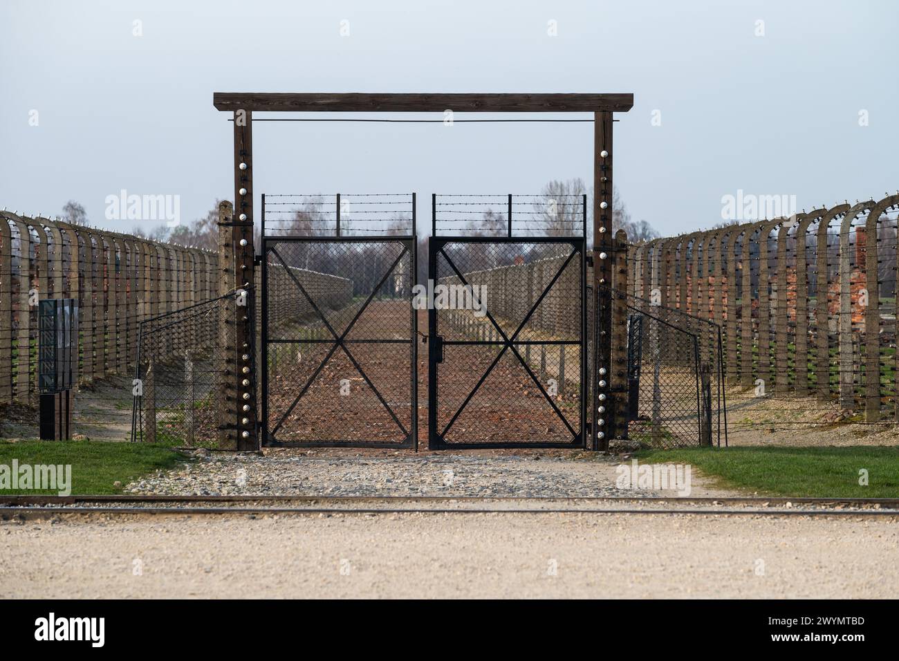 Auschwitz, Poland, March 21, 2024 - Wired fence at the extermination camp Stock Photo