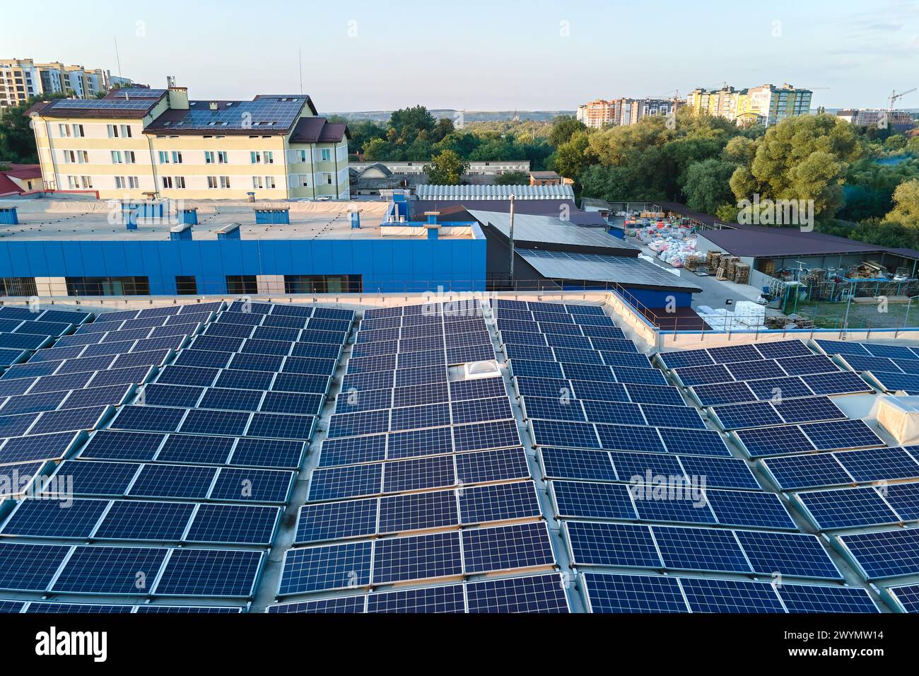 Aerial view of blue photovoltaic solar panels mounted on industrial ...