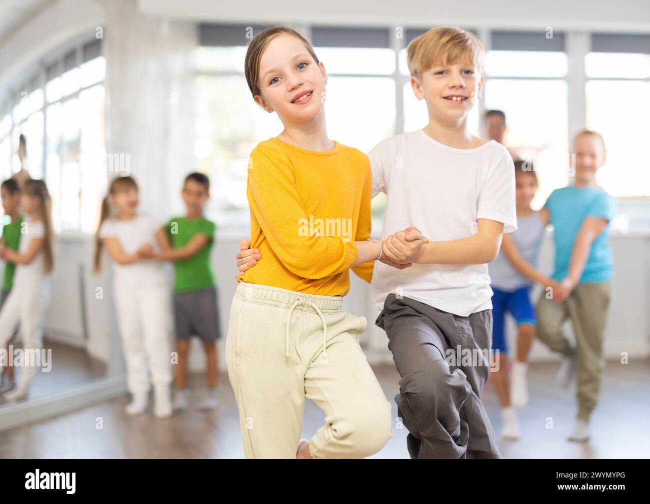 Girl paired up with boy and training to perform slow couple dance ...