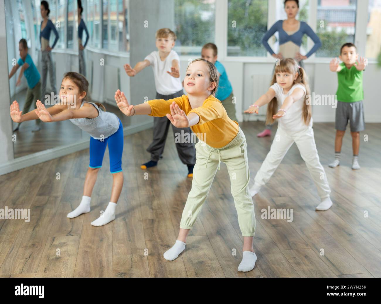 Group of children warming up before dance class Stock Photo