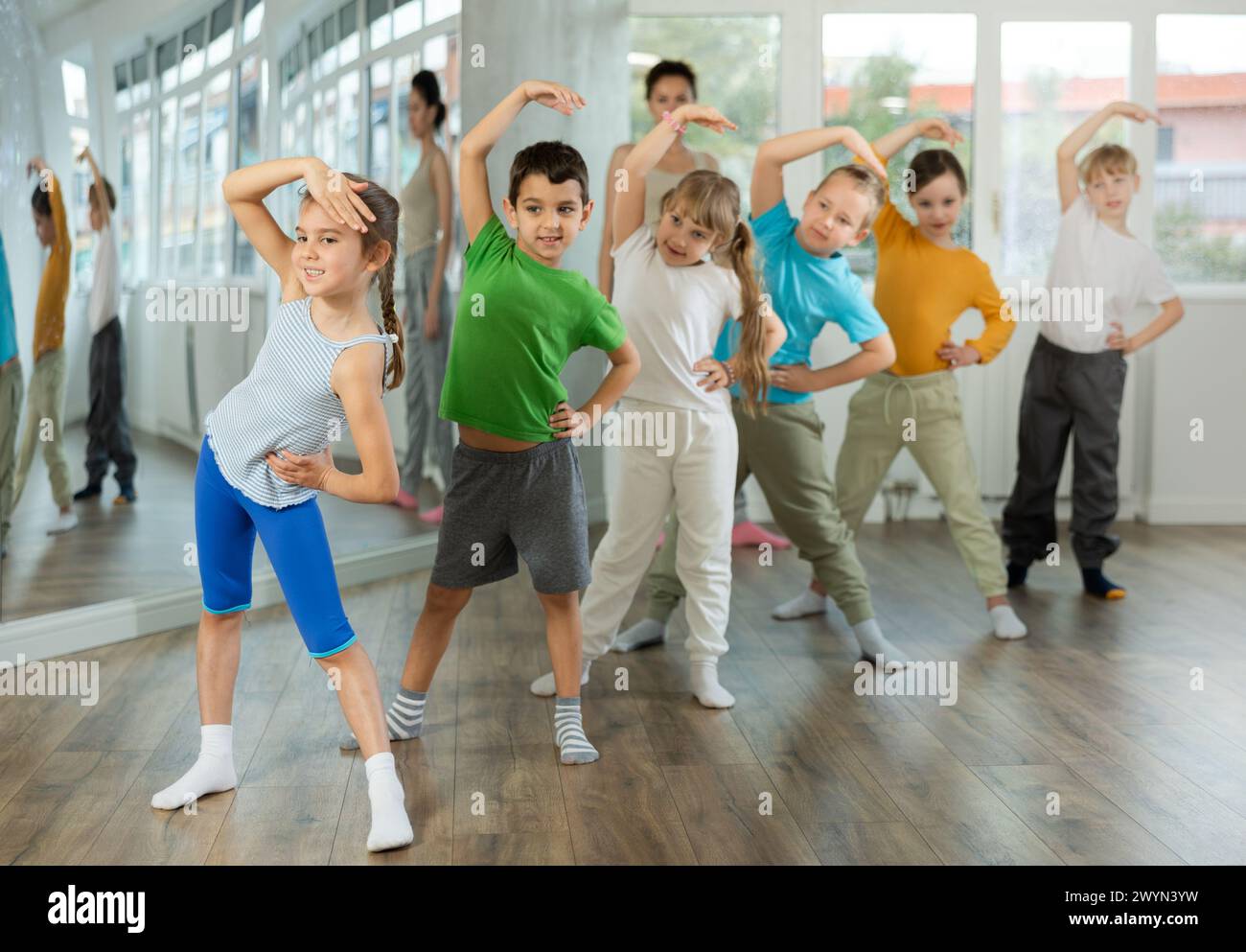 Group of children warming up before dance class Stock Photo