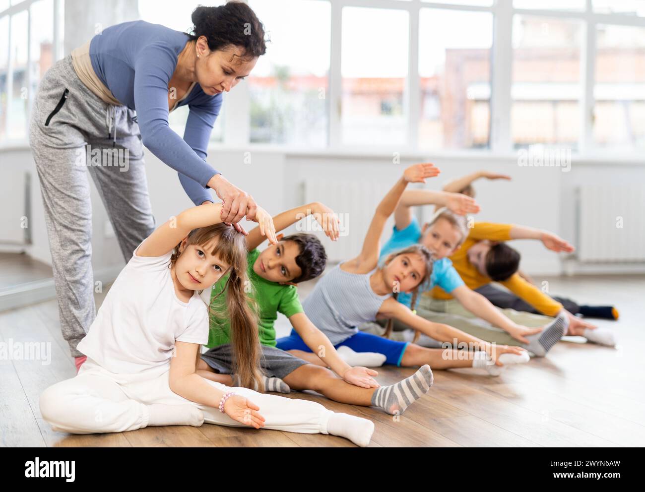 Group of children warming up before dance class Stock Photo