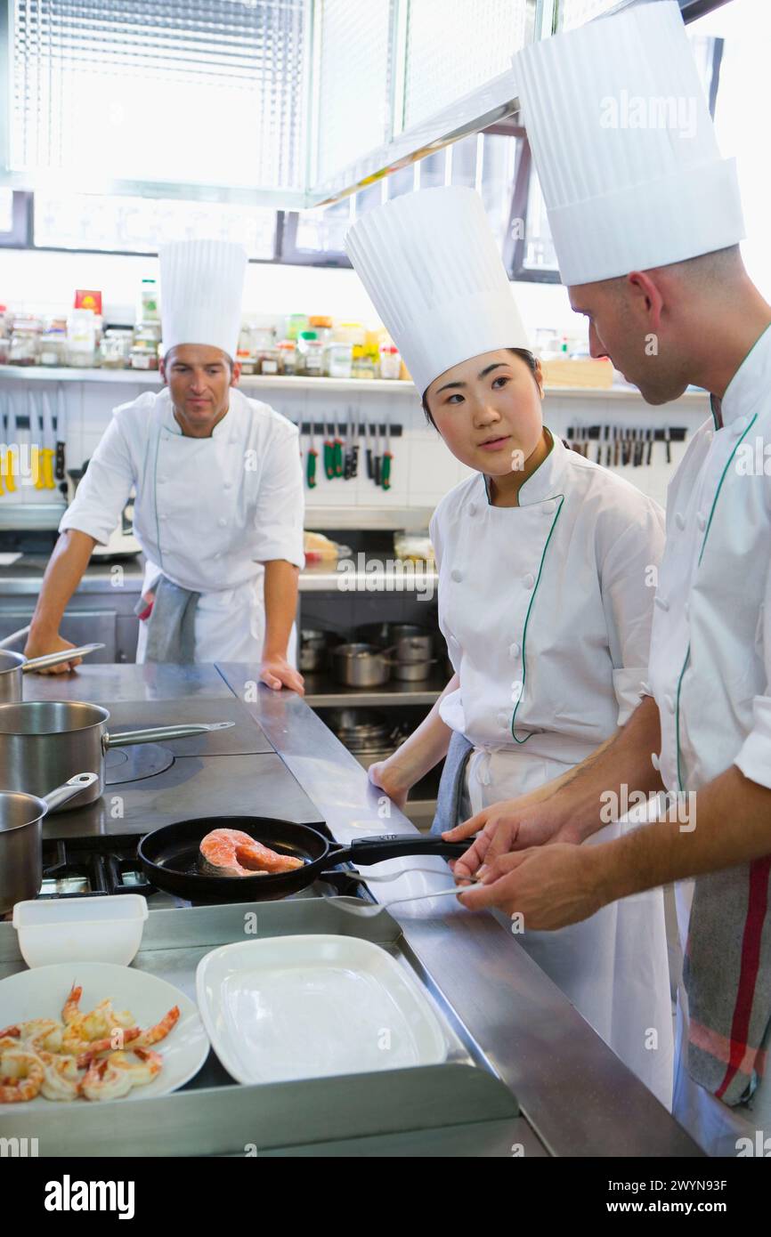 Sauteing prawns y salmon. Luis Irizar cooking school. Donostia, Gipuzkoa, Basque Country, Spain. Stock Photo