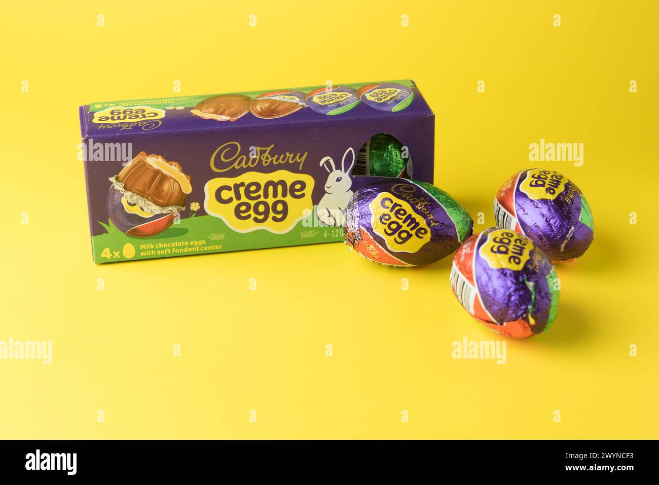 box of cadburys milk chocolate creme eggs yellow background Stock Photo