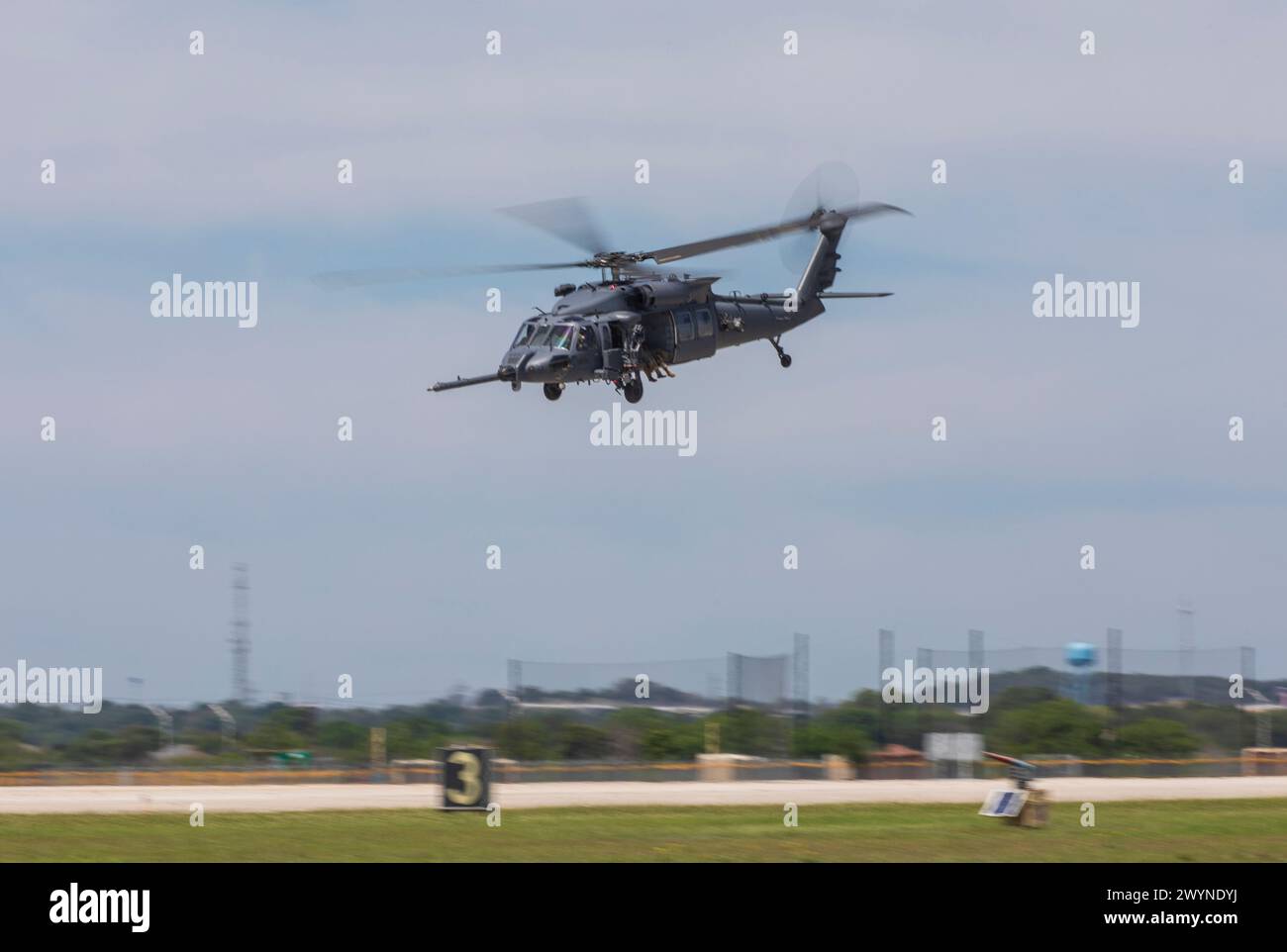 A U.S. Air Force HH-60 Pave Hawk performs at Joint Base San Antonio-Randolph, Texas for The Great Texas Airshow practice day, April 5, 2024. The HH-60 demo is just one of many aerial and ground performers that participated in the airshow to accompany static displays, educational booths, vendors, and kids’ zone. The performances and displays at the airshow highlight the pride, precision and professionalism the U.S. Air Force represents. (U.S. Air Force photo by Joseph Kumzak). Stock Photo