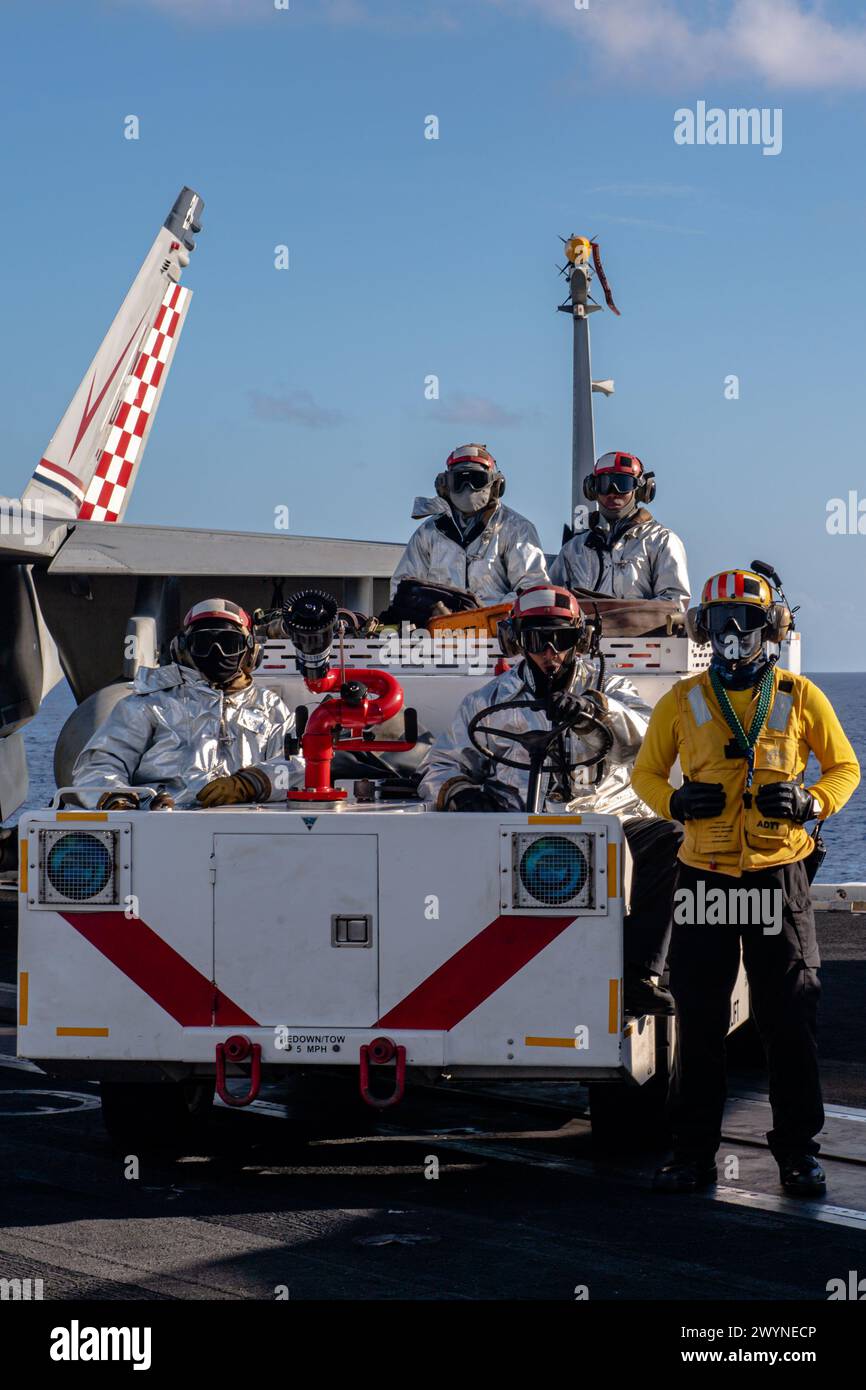 PHILIPPINE SEA (April 7, 2024) Crash and Salvage Sailors stand watch ...